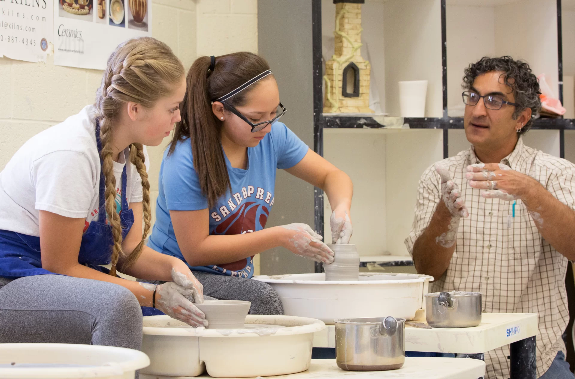 Clay Teacher With Students Cropped.webp